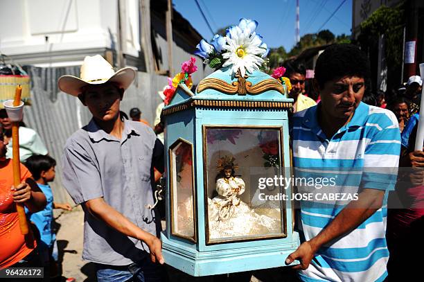 Catholic faithfuls carry an image of Jesus Christ as the participate in the procession "Los Niños Zarcos" , in the town of San Pedro Nonualco, 62 km...