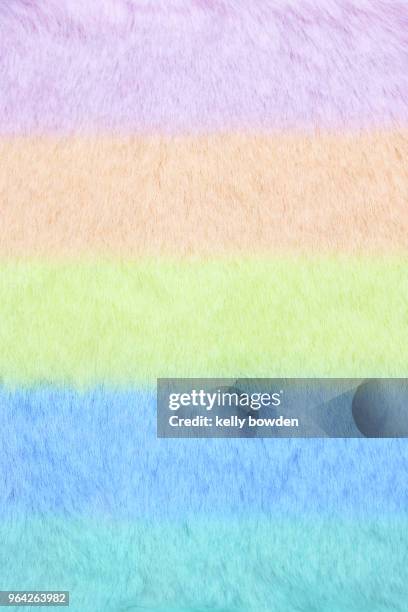 soft pastel rainbow fluffy fake fur background fabric material - kelly bowden stockfoto's en -beelden