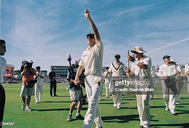 Glenn McGrath of Australia holds the ball aloft after taking 5 wickets for 43 runs in the second innings of the Fifth Ashes Test match between...