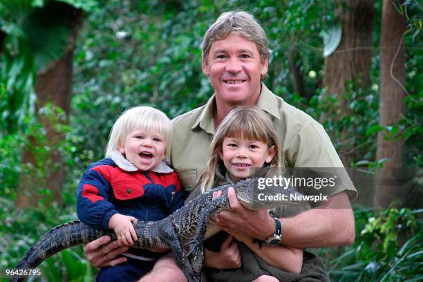 Crocodile Hunter' Steve Irwin with his children, Bindi Irwin and Bob Irwin, and a 3-year-old alligator called 'Russ' at Australia Zoo in Queensland.