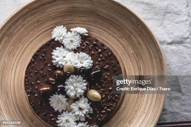 cacao chocolate cake with wild flowers - almond garnish stock pictures, royalty-free photos & images
