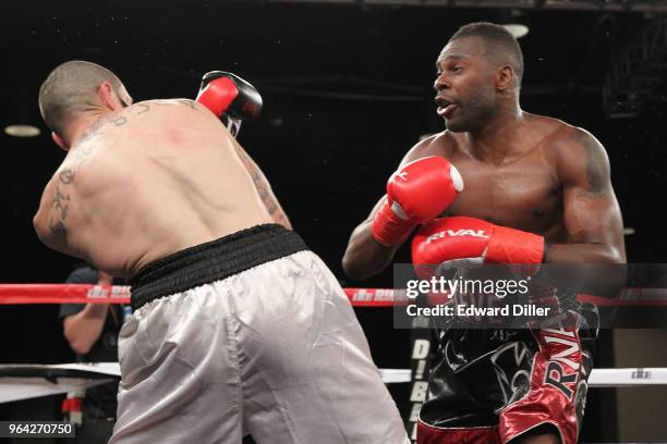 Steve Rolls trades punches with Emmanuel Sanchez at the Resorts World Casino on June 03, 2016 in the Queens borough of New York City. Sanchez would...