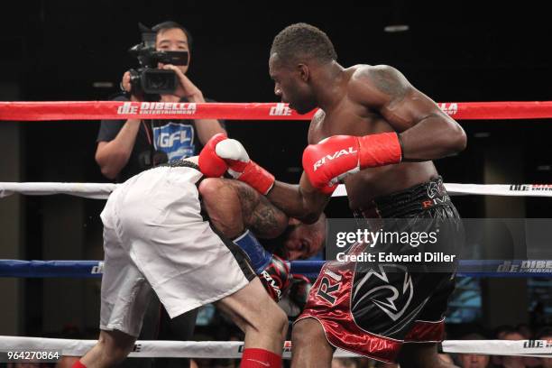 Steve Rolls lands a right hand against Emmanuel Sanchez at the Resorts World Casino on June 03, 2016 in the Queens borough of New York City. Sanchez...