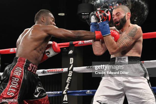 Steve Rolls lands a right hand against Emmanuel Sanchez at the Resorts World Casino on June 03, 2016 in the Queens borough of New York City. Sanchez...