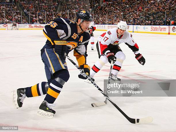 Jochen Hecht of the Buffalo Sabres skates around Filip Kuba of the Ottawa Senators on February 3, 2010 at HSBC Arena in Buffalo, New York.