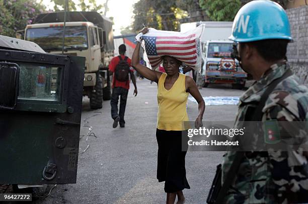 In this handout image provided by the United Nations Stabilization Mission in Haiti , the United Nations' Peruvian Peacekeepers and the US Army...