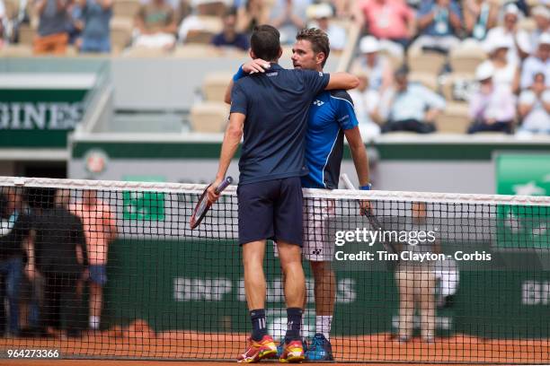 French Open Tennis Tournament - Day Two. Guillermo Garcia-Lopez of Spain is congratulated on his five set win by Stan Wawrinka of Switzerland on...