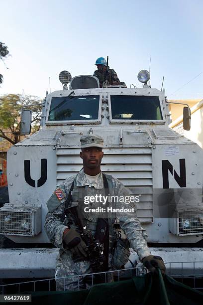 In this handout image provided by the United Nations Stabilization Mission in Haiti , the United Nations' Peruvian Peacekeepers and the US Army...