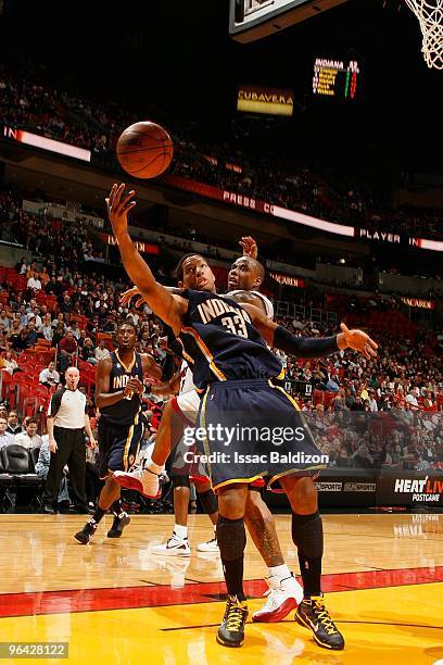 Danny Granger of the Indiana Pacers rebounds against Quentin Richardson of the Miami Heat during the game on January 19, 2010 at American Airlines...