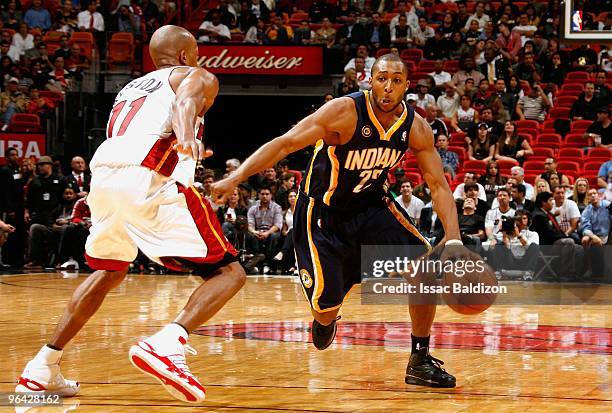 Price of the Indiana Pacers moves the ball against Rafer Alston of the Miami Heat during the game on January 19, 2010 at American Airlines Arena in...