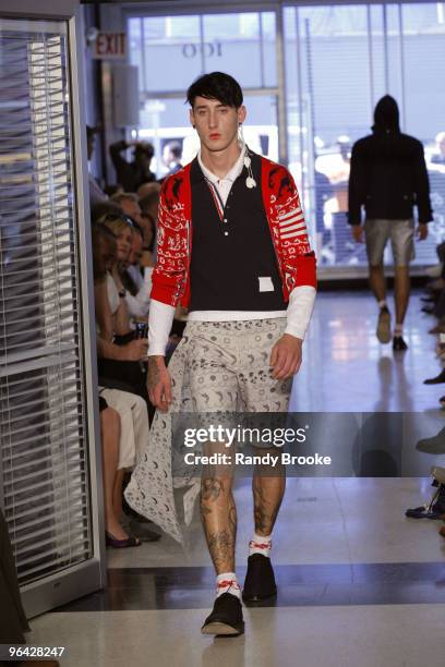 Model walks the runway at the Thom Browne Spring 2010 fashion show during Mercedes-Benz Fashion Week at TBD on September 13, 2009 in New York City.