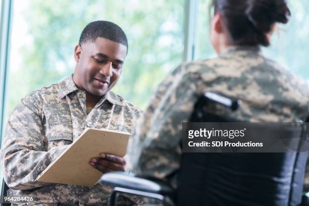 mental health professional talks with injured soldier - injured us army stock pictures, royalty-free photos & images