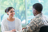 Young woman talks with recruitment officer