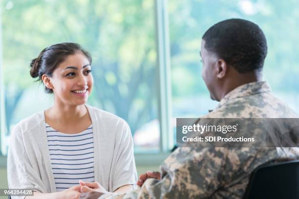 young woman talks with recruitment officer - civil imagens e fotografias de stock