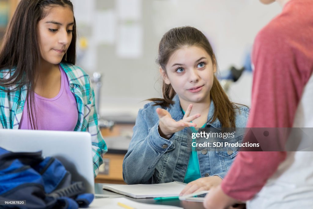 Classmate Rivalry Student Gestures While Talking With Classmate High-Res Stock Photo ...