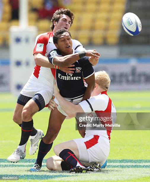 Shalom Suniula of the USA is tackled by Mathew Turner and Donald Barrell of England in the match between England and the USA during day one of the...