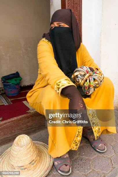 portrait of lady selling metal bands and bracelets, marrakech - burqa for sale stock pictures, royalty-free photos & images
