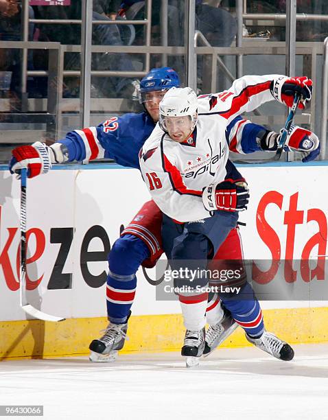 Eric Fehr of the Washington Capitals races for the puck under pressure by Artem Anisimov of the New York Rangers in the second period on February 4,...