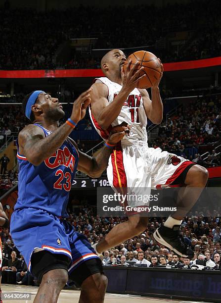 Rafer Alston of the Miami Heat tries to get past LeBron James of the Cleveland Cavaliers on February 4, 2010 at the Quicken Loans Arena in Cleveland,...