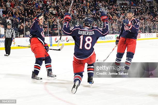 Umberger of the Columbus Blue Jackets celebrates his game-winning goal against the Dallas Stars with teammates Antoine Vermette and Rick Nash of the...
