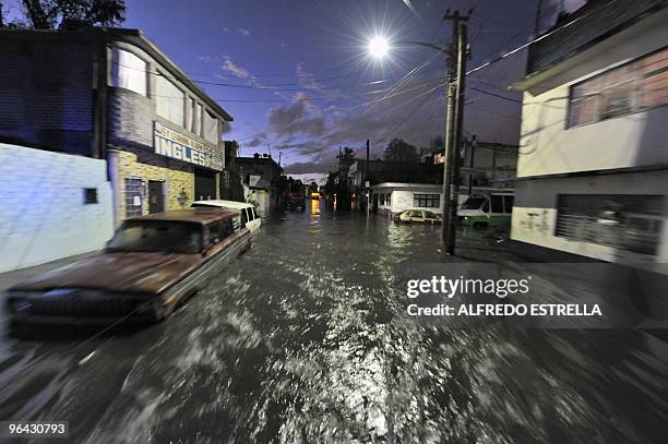 Flooded street is seen in the Arenal neighborghood of Mexico City on February, 2010. Heavy rains swelled the canal of "Bordo Xochiaca" causing the...