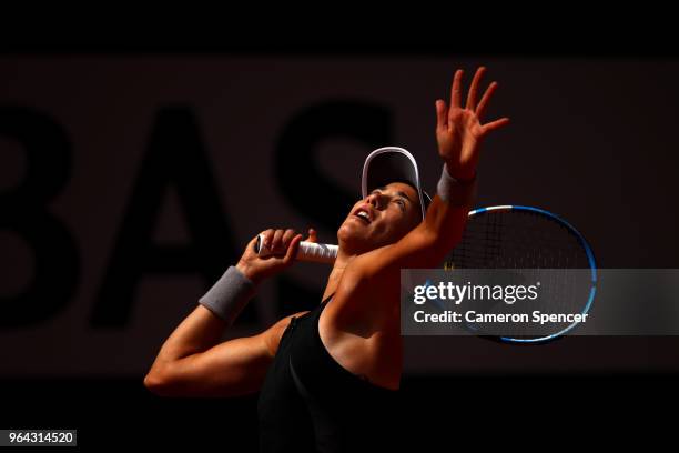 Garbine Murguruza of Spain serves during her ladies singles second round match against Fiona Ferro of France during day five of the 2018 French Open...