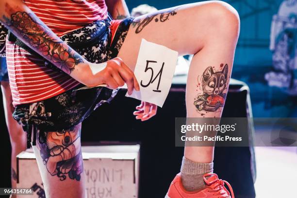 Contestants showing off their tattoos as part of a competition at the Polish Tattoo Festival attended by 300 exhibitors.