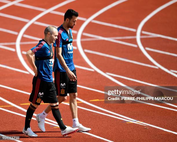 Spain's midfielder Andres Iniesta and Spain's defender Sergio Busquets attend a training session of Spain's national football team at the City of...