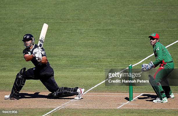Ross Taylor of New Zealand sweeps the ball away for four runs during the first one day international match between the New Zealand Black Caps and...