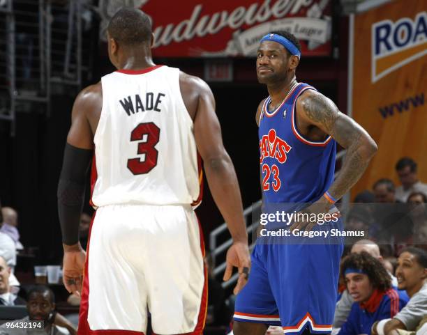 Dwyane Wade of the Miami Heat talks with LeBron James of the Cleveland Cavaliers on February 4, 2010 at the Quicken Loans Arena in Cleveland, Ohio....