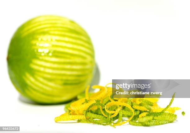 grated lemon and lime zest - scorza di limone foto e immagini stock