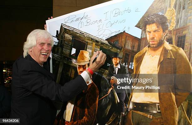 Photographer Douglas Kirkland signs one of his photographs during the opening night of Cinema Italian Style 2009 US premiere of the "Baaria" at the...