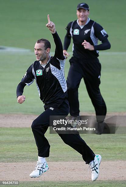 Andrew McKay of New Zealand celebrates the wicket of Imrul Kayes of Bangladesh during the first one day international match between the New Zealand...