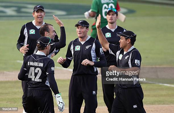 Andrew McKay of New Zealand celebrates the wicket of Imrul Kayes of Bangladesh during the first one day international match between the New Zealand...
