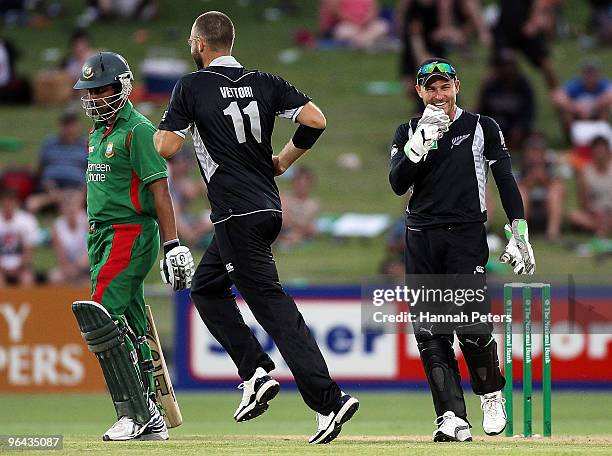 Tamim Iqbal Khan of Bangladesh walks off after being caught by Brendon McCullum of New Zealand off the bowling of Daniel Vettori during the first one...