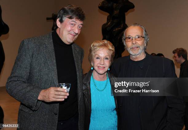 Actor Stephen Fry, Pat York and Herb Alpert, artist pose at the Black Totem Series Artist Reception held at Ace Gallery on February 4, 2010 in...