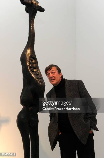 Actor Stephen Fry poses at the Herb Alpert Black Totem Series Artist Reception held at Ace Gallery on February 4, 2010 in Beverly Hills, California.