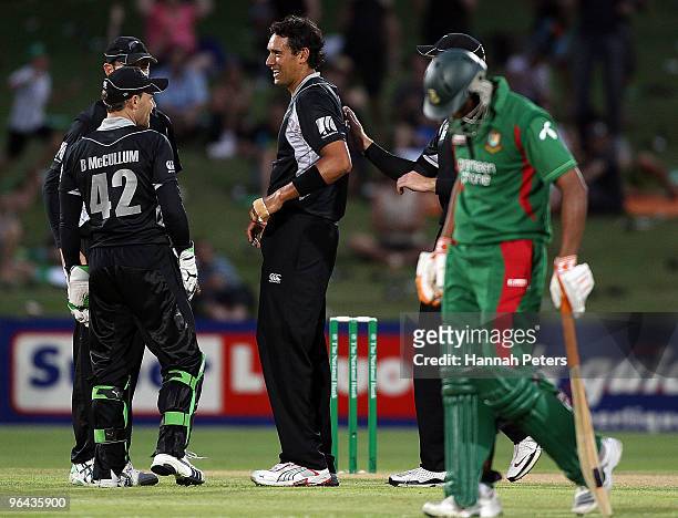 Daryl Tuffey of New Zealand celebrates the wicket of Mushfiqur Rahim of Bangladesh caught by Brendon McCullum of New Zealand during the first one day...