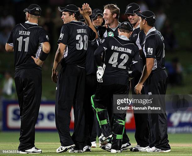 Martin Guptill of New Zealand celebrates the wicket of Naeem Islam of Bangladesh during the first one day international match between the New Zealand...