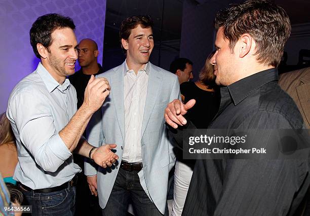Driver Jimmie Johnson, Eli Manning of the New York Giants and singer/TV personality Nick Lachey attend the Super Skins Kick Off Party at Hotel 944...