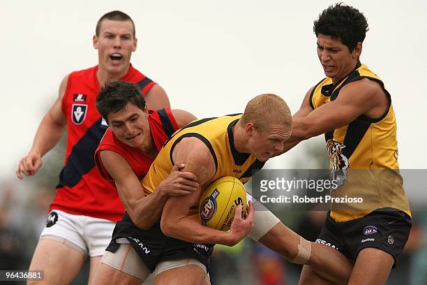 Kel Moore is tackled during a Richmond Tigers intra-club AFL match at Highgate Reserve on February 5, 2010 in Melbourne, Australia.