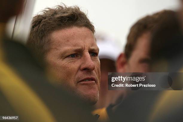 Coach Damien Hardwick talks to his players during a Richmond Tigers intra-club AFL match at Highgate Reserve on February 5, 2010 in Melbourne,...