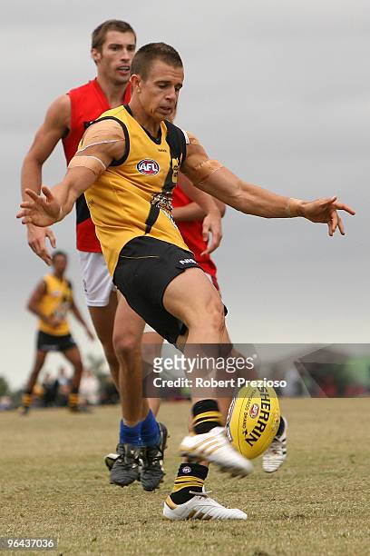 Brett Deledio kicks during a Richmond Tigers intra-club AFL match at Highgate Reserve on February 5, 2010 in Melbourne, Australia.