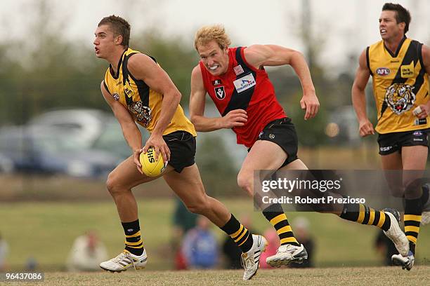 Dustin Martin runs with the ball during a Richmond Tigers intra-club AFL match at Highgate Reserve on February 5, 2010 in Melbourne, Australia.