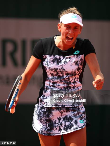 Elise Mertens of Belgium celebrates winning the first set during her ladies singles second round match against Heather Watson of Great Britain during...