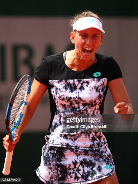 Elise Mertens of Belgium celebrates winning the first set during her ladies singles second round match against Heather Watson of Great Britain during...