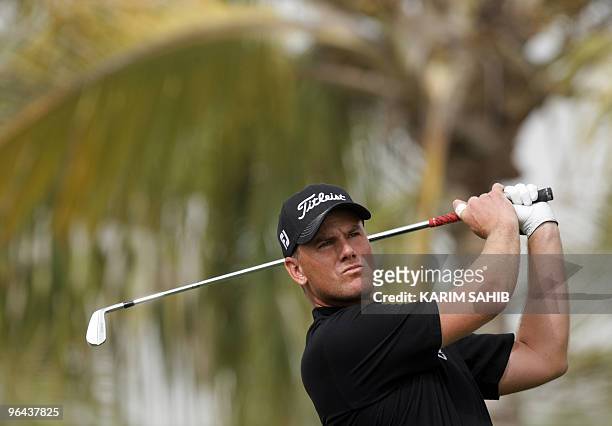 Robert Karlsson of Sweden competes in the first round of the 2.5 million dollars Dubai Desert Classic golf tournament at the Emirates Golf Club on...