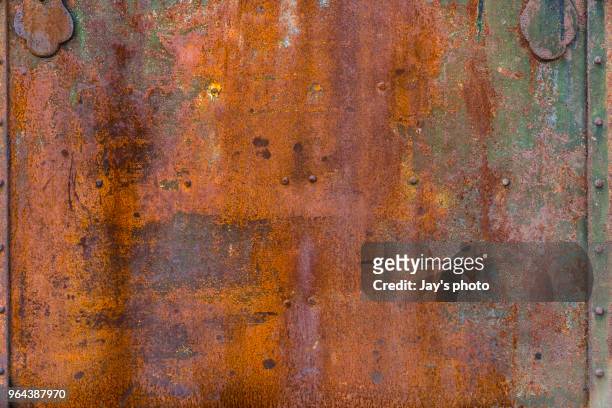 full frame shot of rusty metal - rostig stock-fotos und bilder