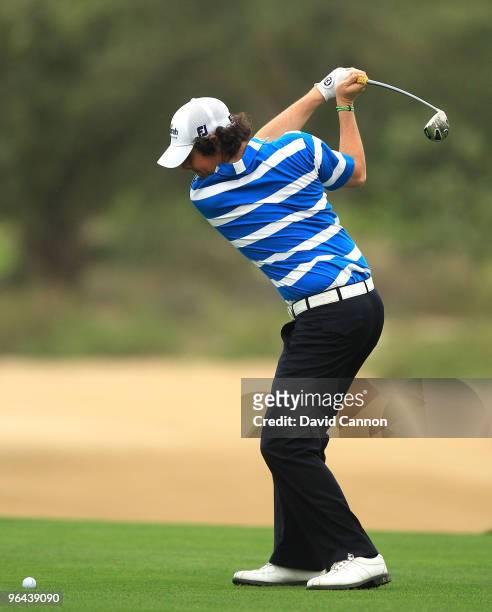 Rory McIlroy of Northern Ireland plays his second shot at the 3rd hole during the second round of the 2010 Omega Dubai Desert Classic on the Majilis...