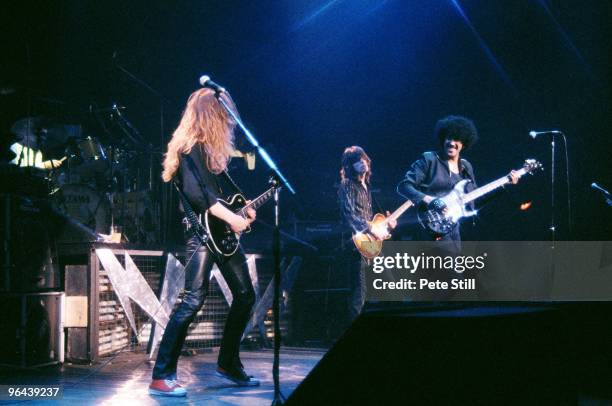 John Sykes, Phil Lynott and Scott Gorham of Thin Lizzy perform on stage, on the 'Thunder and Lightning' tour at Hammersmith Odeon on March 10th, 1983...